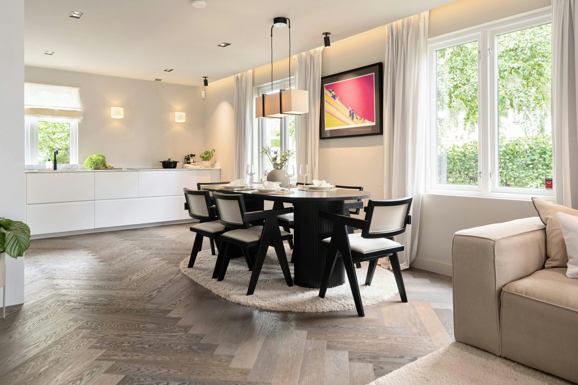 A living room filled with furniture and a dining room table
